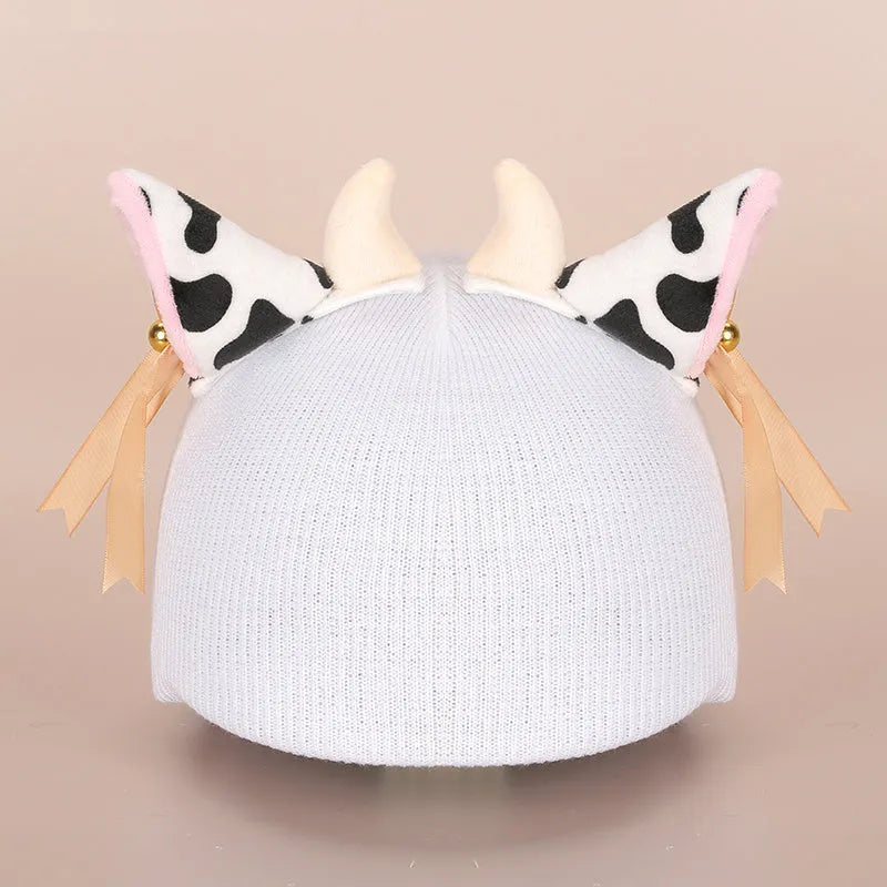 A plush fabric helmet cover with cartoon character ears, shown in size M for bicycle or motorbike use.
