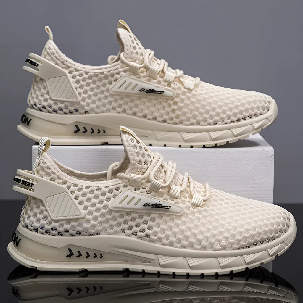 Men's beige casual sneaker with synthetic leather upper, mesh lining, and flat EVA sole on a plain background.