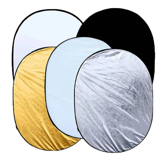 Collapsible 5-in-1 photography light reflector showing gold, silver, white, black, and translucent surfaces