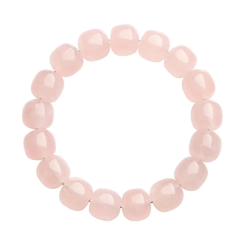 Pink crystal barrel bead bracelet with geometric design for men and women.