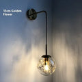 Modern glass wall mounted bedside lamp with LED light in golden flower finish