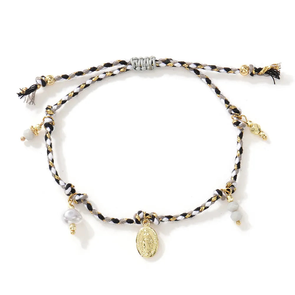 Hand-woven colourful braided rope bracelet with adjustable knot and decorative strap tag