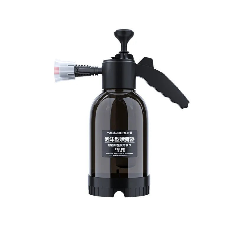 Black 2 litre handheld foam spray watering can with a comfortable handle and two nozzle attachments.