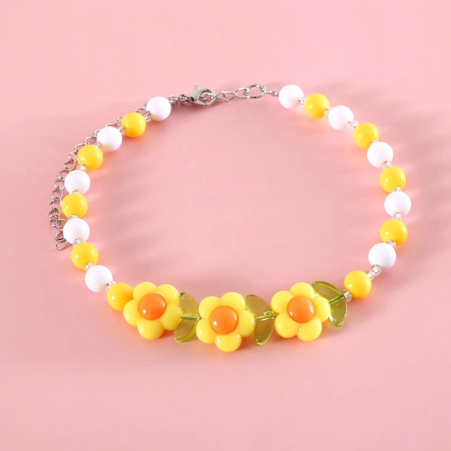 Colourful plastic bead pet necklace in peach, rainbow, or small flower patterns with adjustable sizing.