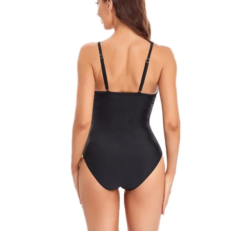A black or blue ladies' backless one-piece swimsuit made from mesh fabric.