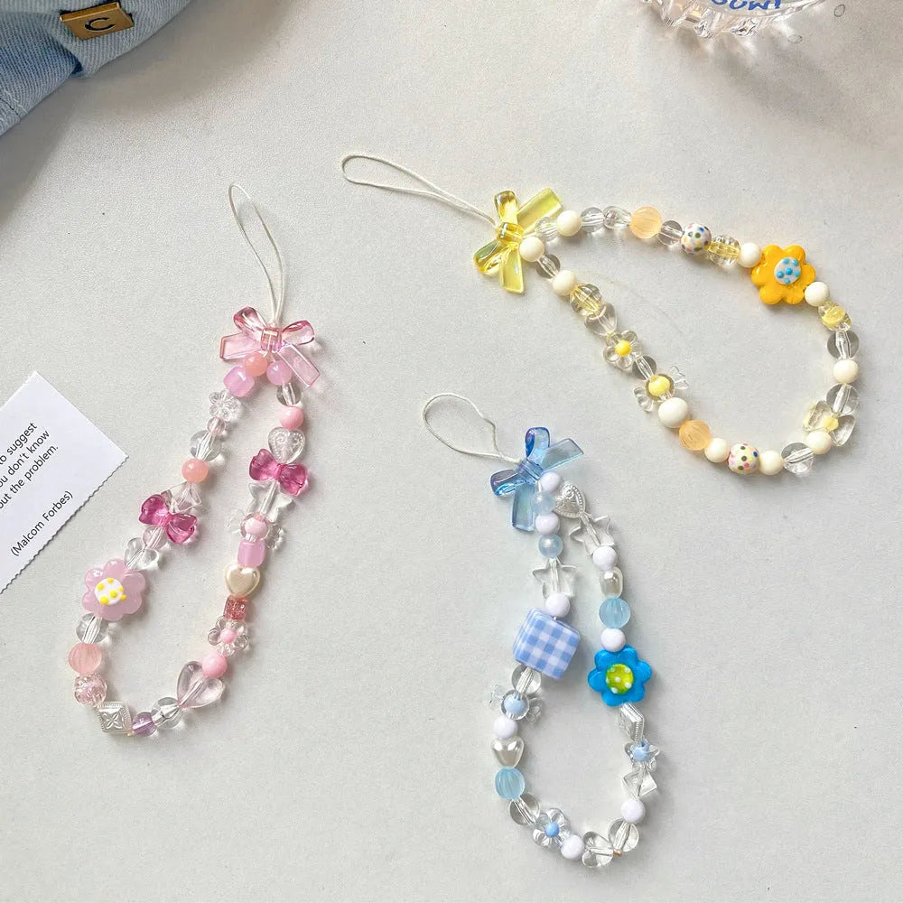 Colourful beaded flower mobile phone lanyard with hand rope and decorative floral elements