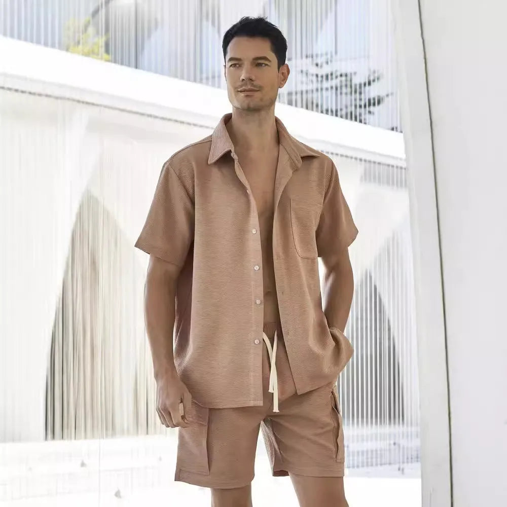Women's beige elastic waist shorts and short sleeve top two-piece set laid flat.
