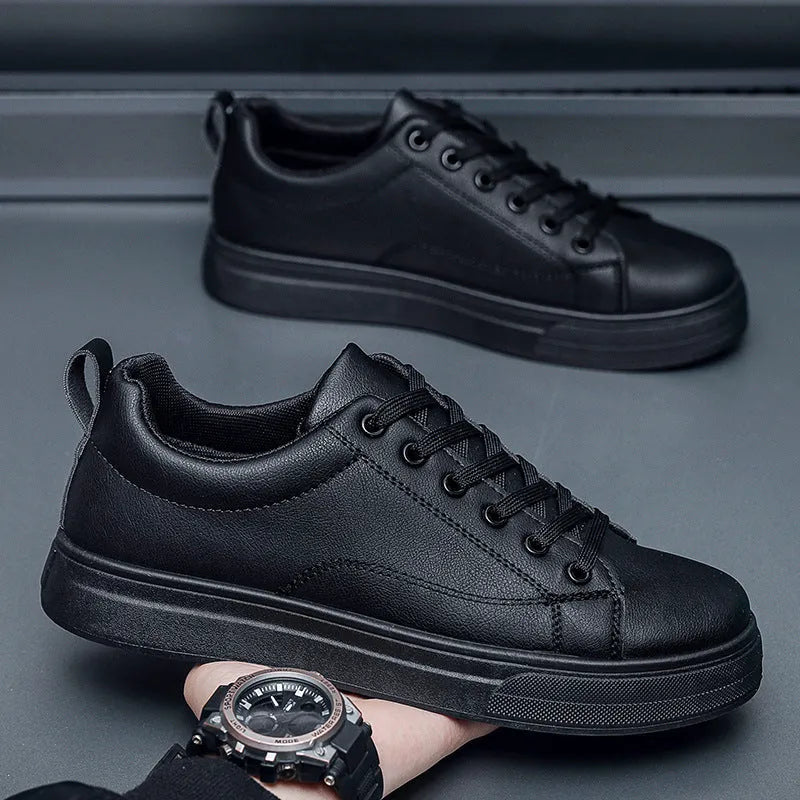 Men's low-top white breathable sneakers with a rubber sole on a plain background