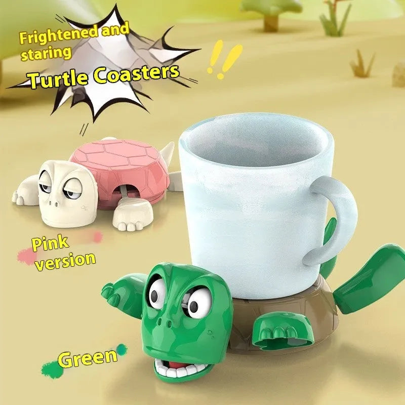 Turtle-shaped ceramic style coaster in green and yellow colours on a wooden table