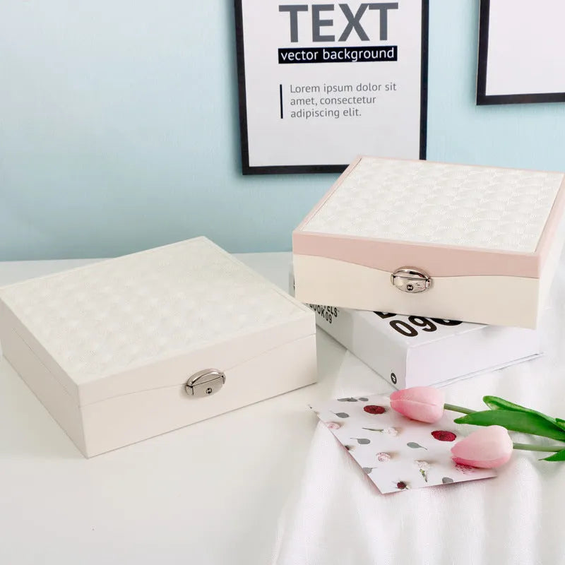 Red and white PU leather jewellery storage box with multiple compartments for necklaces and rings
