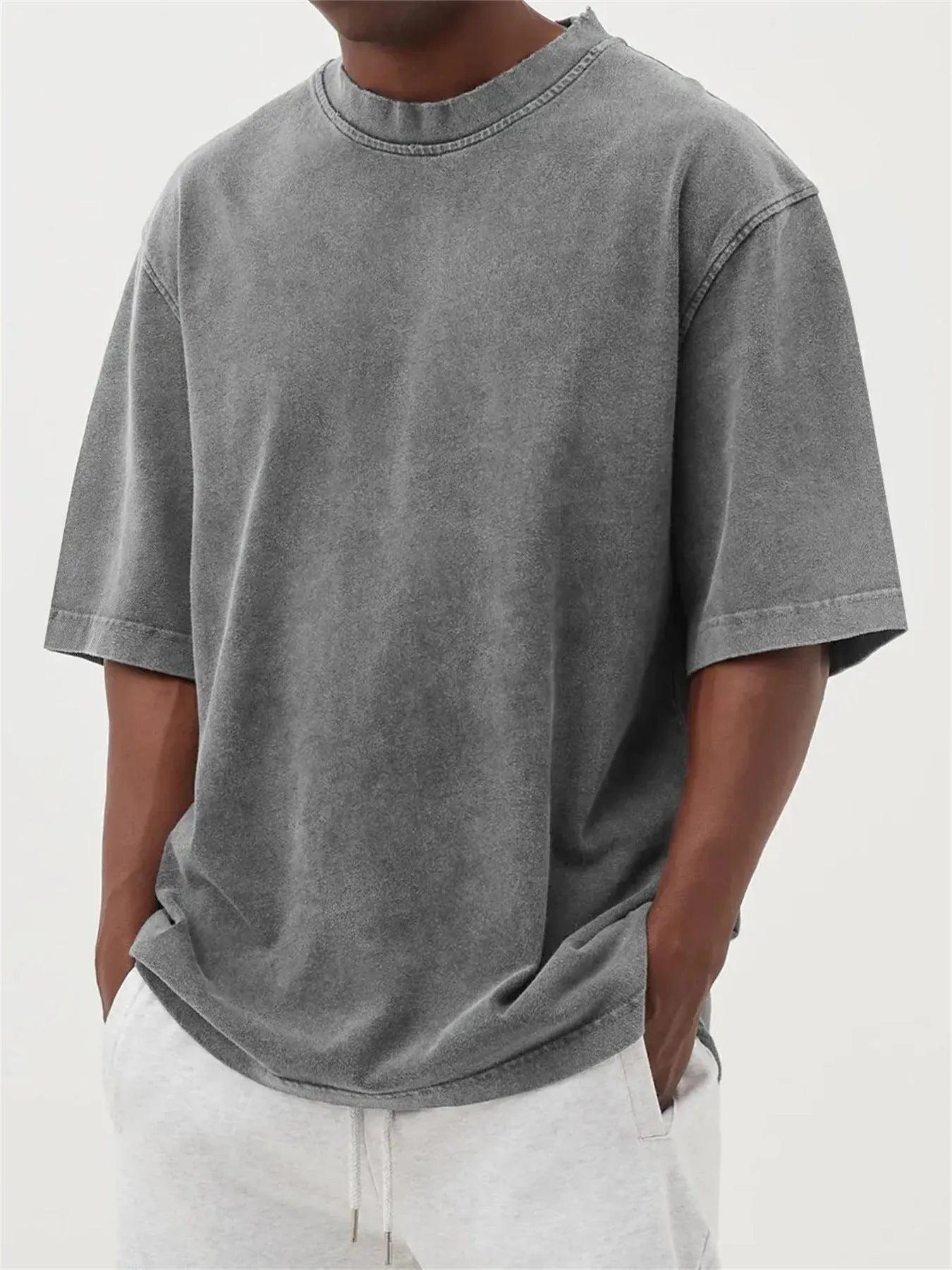 Men's distressed stone wash pullover T-shirt in loose fit with half sleeves available in multiple solid colours