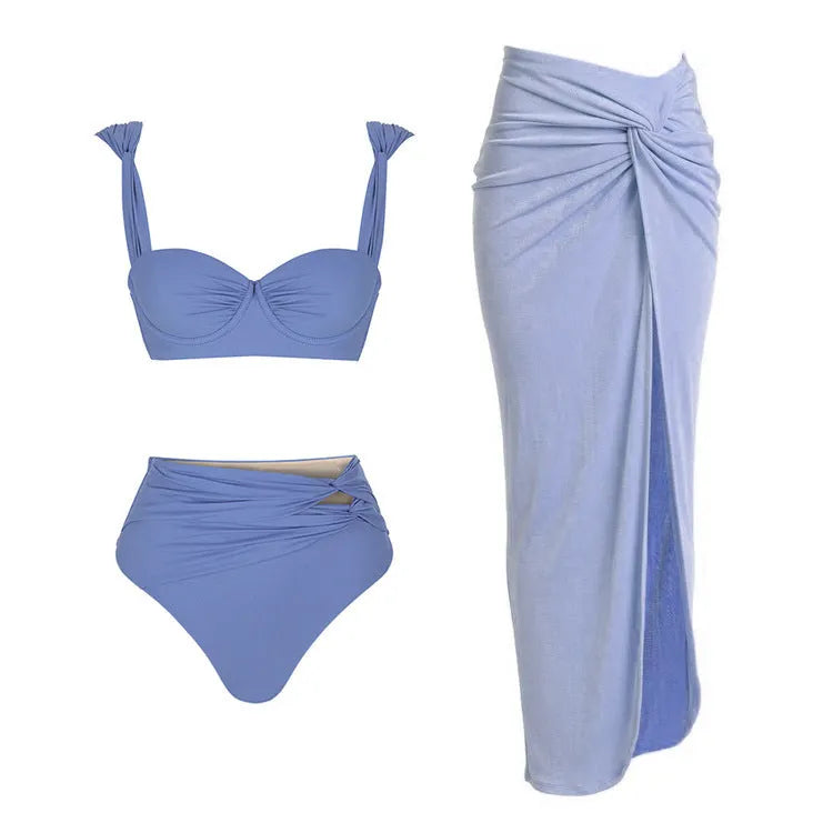 Women's one-piece swimsuit with matching skirt in assorted colours showing gold button detail