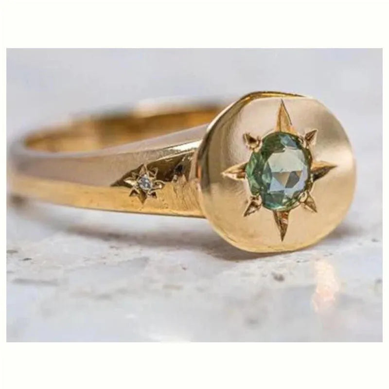 Gold oval asterism zircon ring with adjustable opening and star-shaped micro inlay design