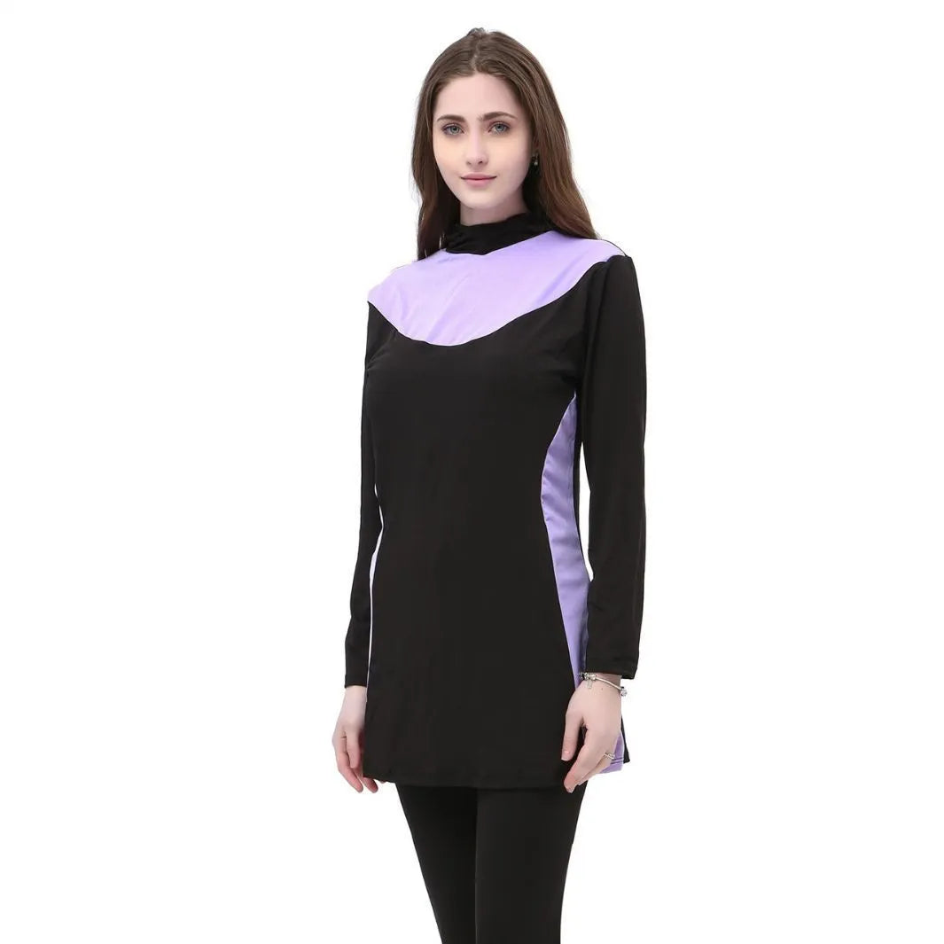 Women's black long sleeve hooded swimsuit with separate pants, shown on a model.