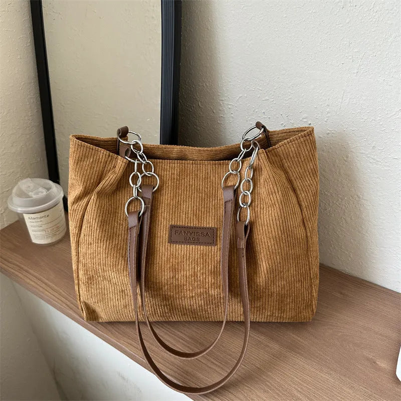 Corduroy one-shoulder tote handbag in street style with three-dimensional pocket