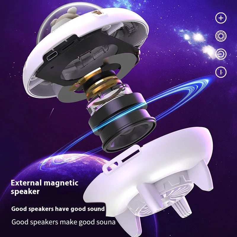 Creative UFO mini Bluetooth speaker in black with round design, showing charging port and speaker grille