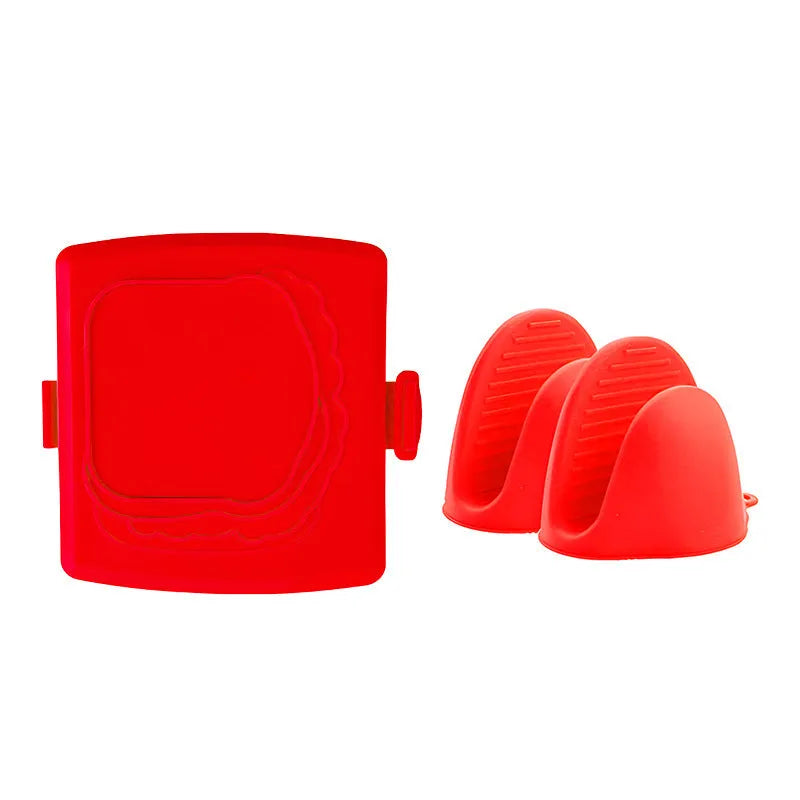 Red silicone baking tray with matching heat-resistant gloves on kitchen counter