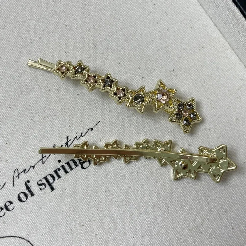 Gold Korean-style alloy hair barrettes with broken clip and star decoration.