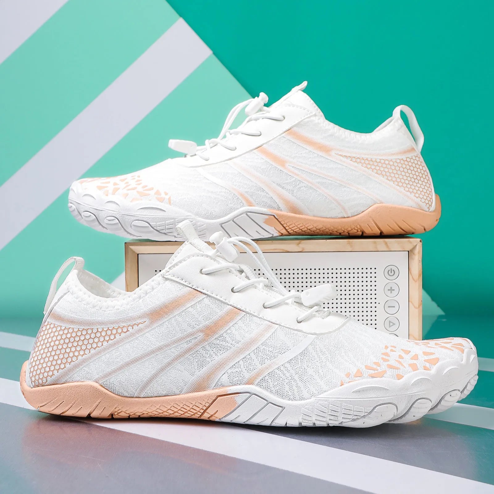 Pair of casual unisex running shoes with Lycra stretch fabric upper, shown in beige colour.