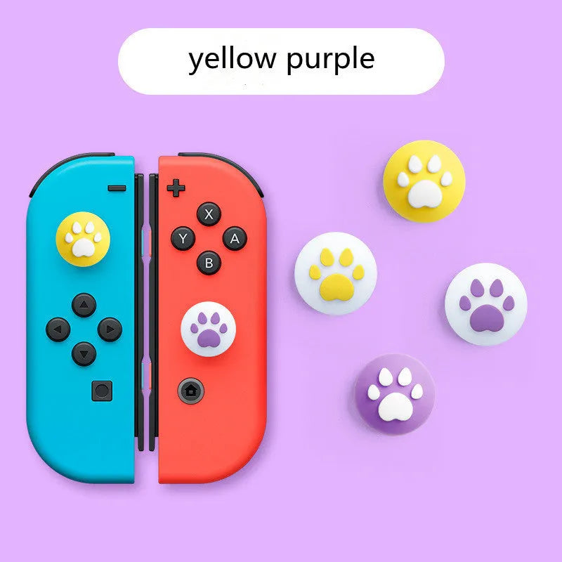 Four silicone rocker caps for Nintendo Switch Joy-Con controllers in assorted colours on a grey background.