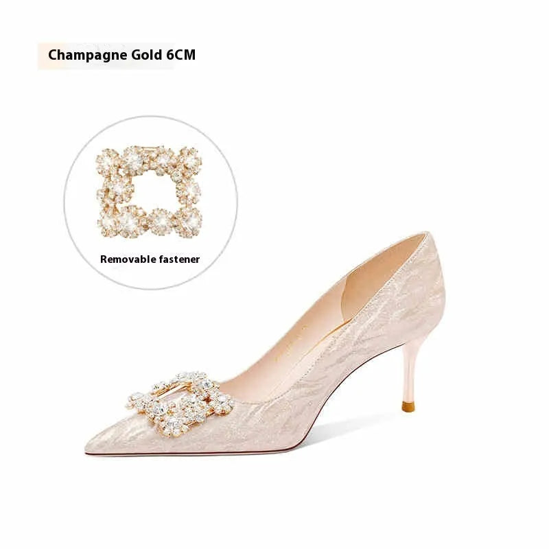 Champagne gold women's pointed-toe stiletto heels with rhinestone detail on the upper.