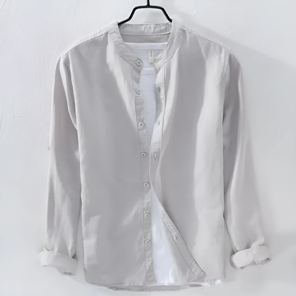 Loose fit long sleeve cotton linen shirt in solid dark blue colour displayed flat showing casual style