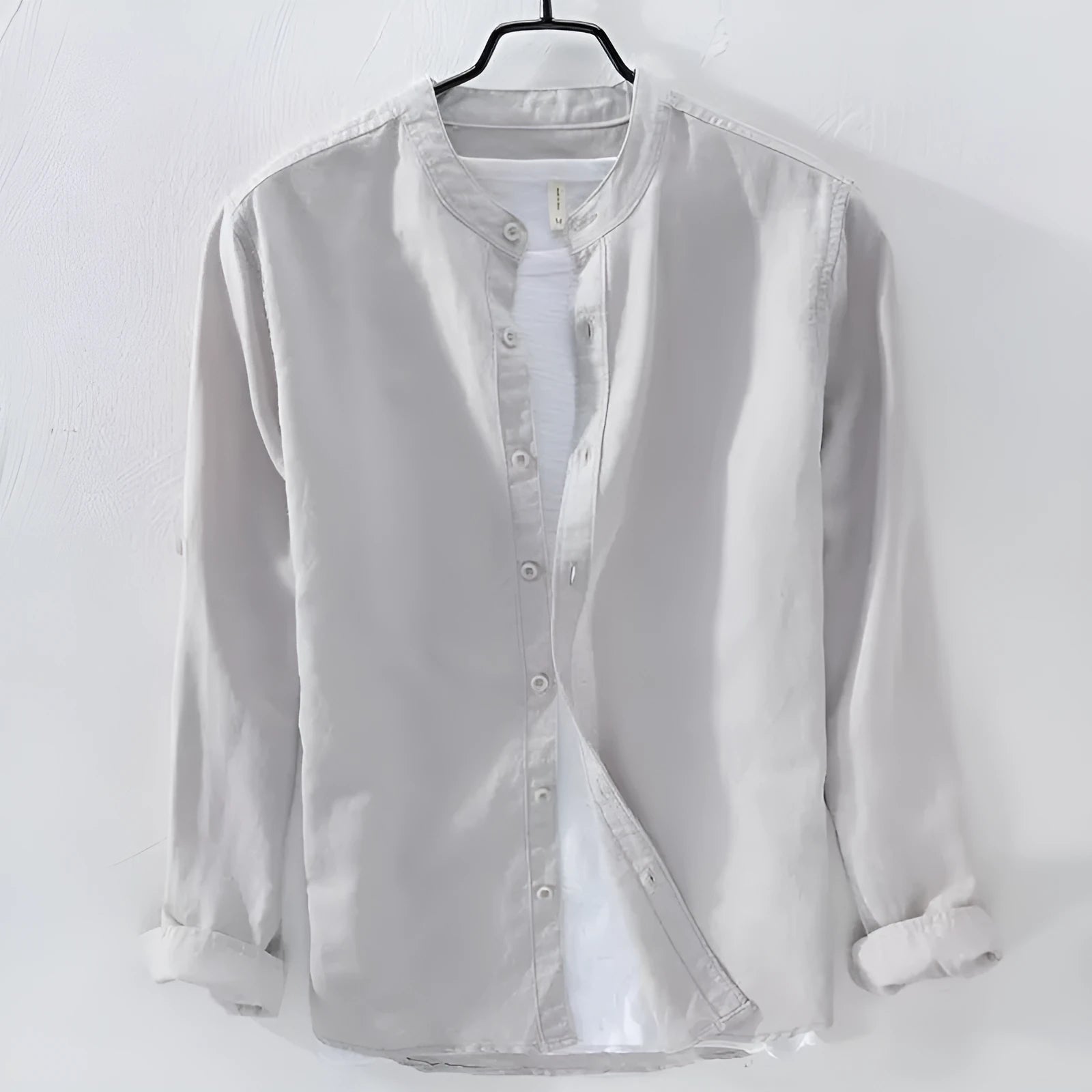 Loose fit long sleeve cotton linen shirt in solid dark blue colour displayed flat showing casual style