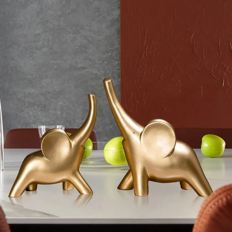 Modern resin elephant ornament in rose gold or white finish, available in large and small sizes