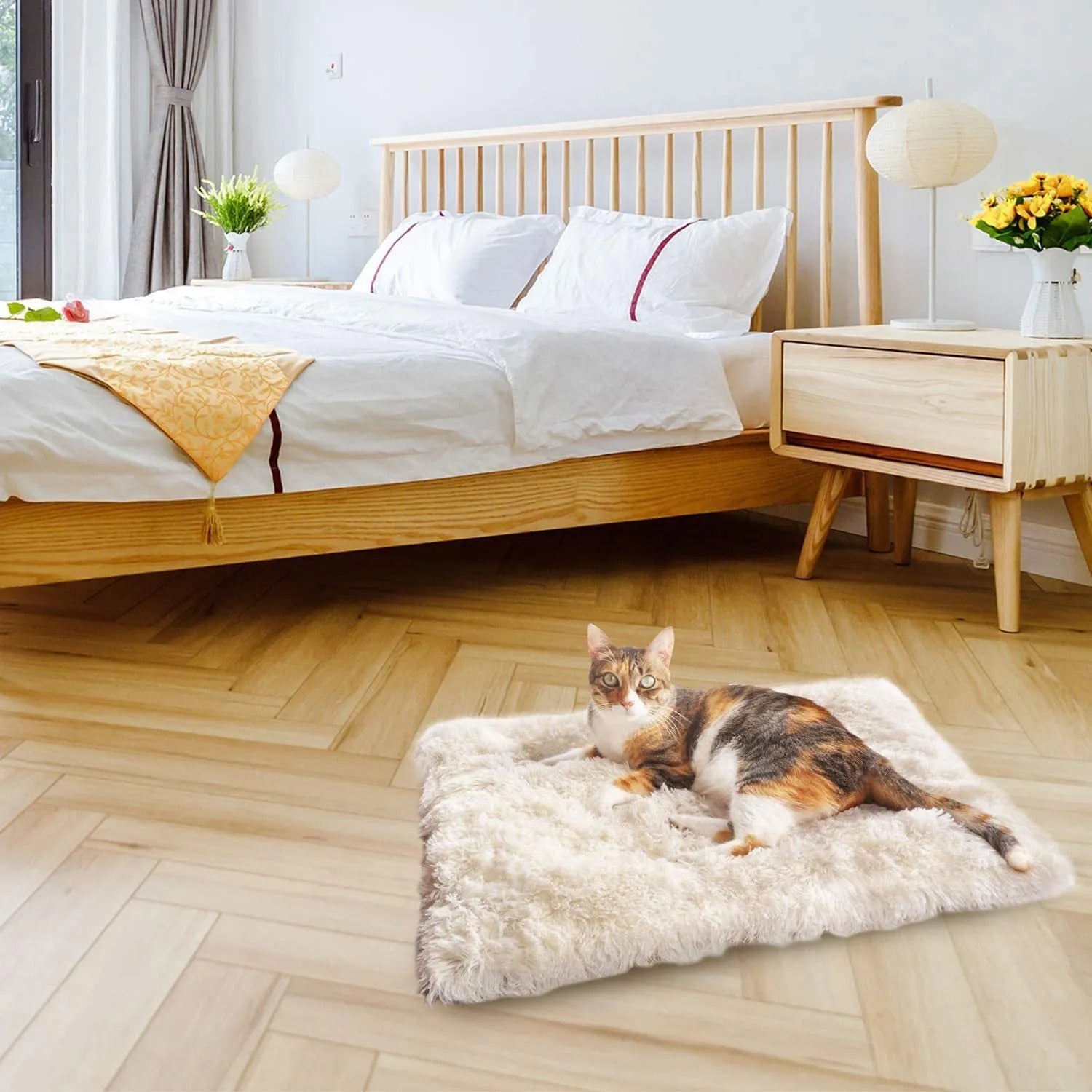 Grey and white long plush pet bed with black non-slip bottom particles