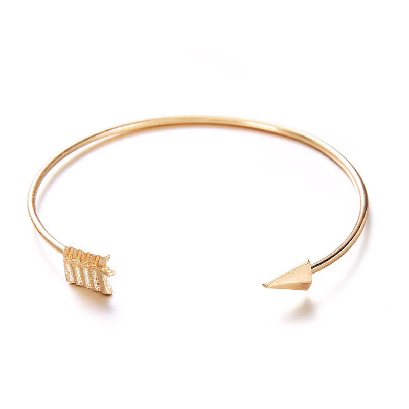 Women's vintage cuff bracelet with arrow knot design in gold electroplated alloy