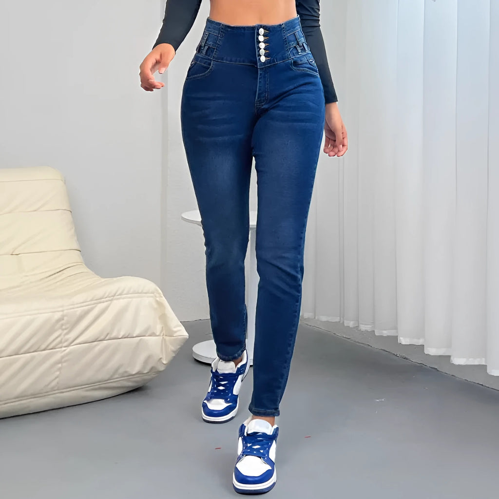 Dark blue women's denim trousers with a breasted waist, straight-leg skinny fit, zipper, and button fastening.