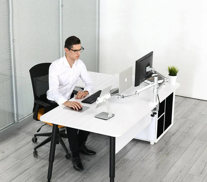 Silver foldable aluminium stand holding a tablet at an angle on a desk