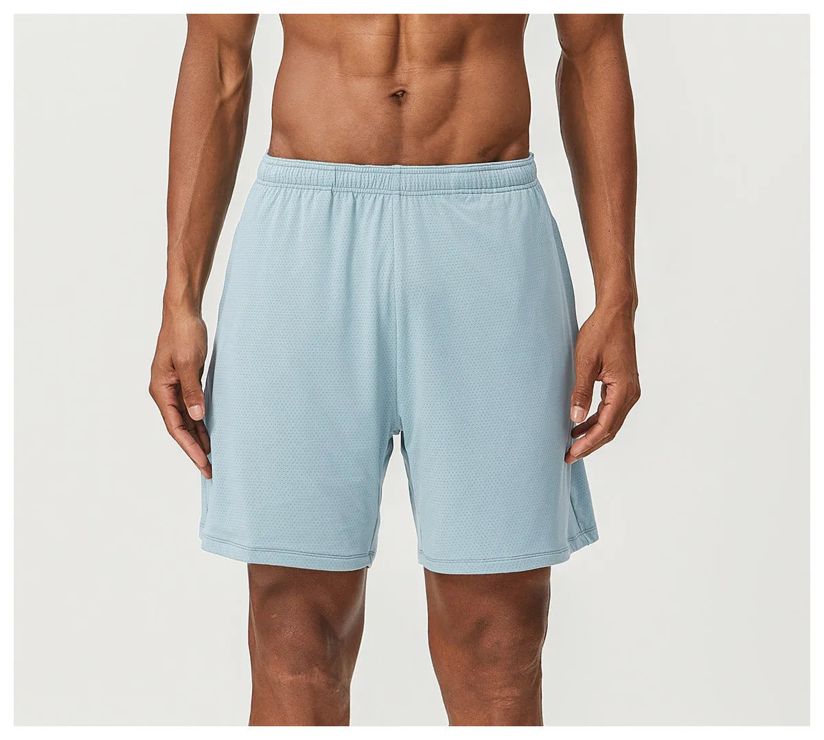 Men's double-layer running shorts in sky green, showing mid-waist fit and shorts length.