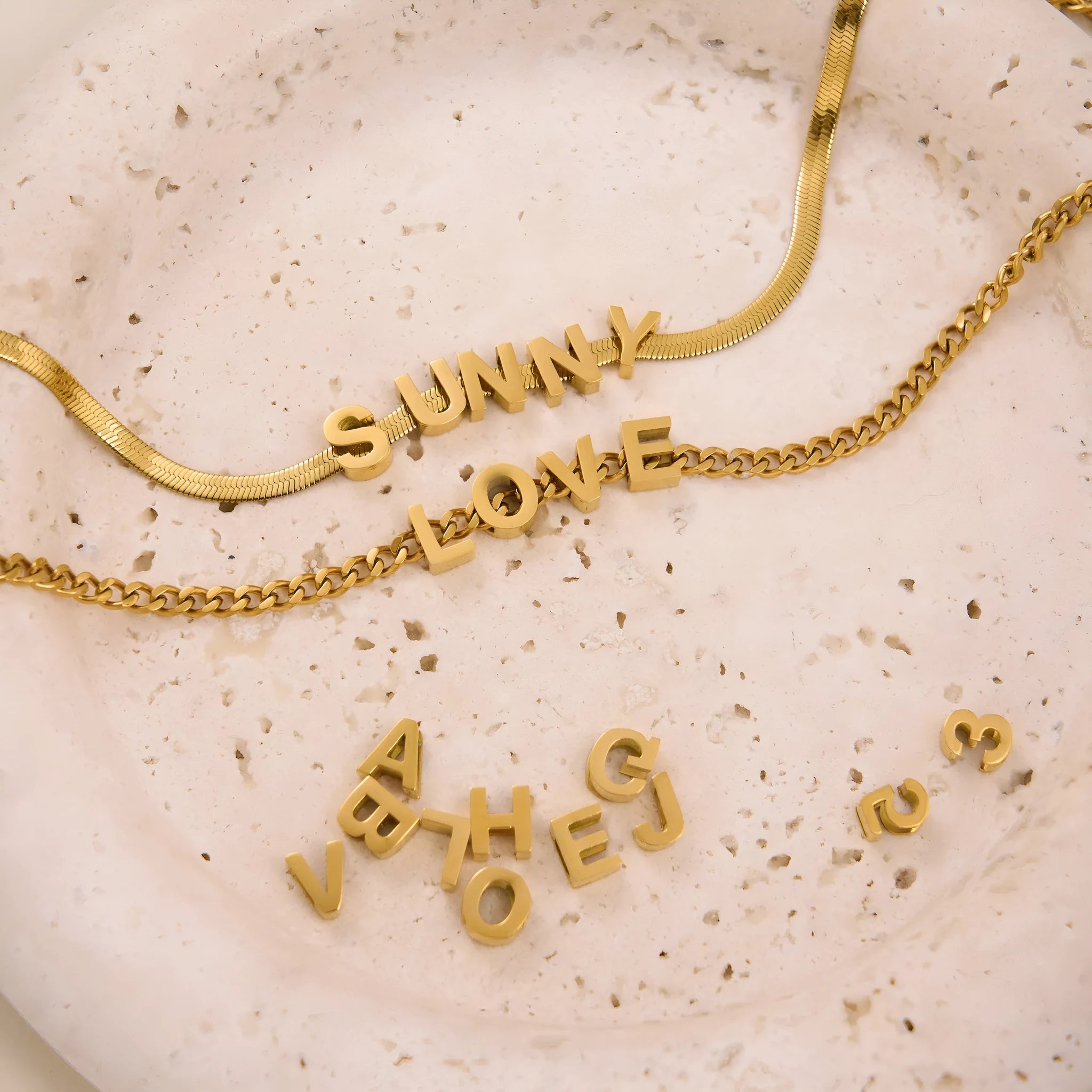 Gold and silver electroplated titanium steel necklace with number and letter pendants on 40.5cm chain