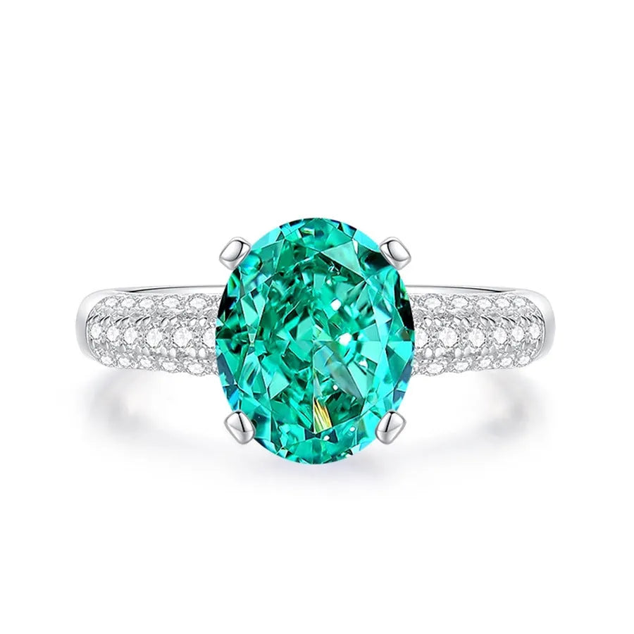 S925 silver emerald ring for women with inlaid high carbon diamonds in a geometric design on a white background.