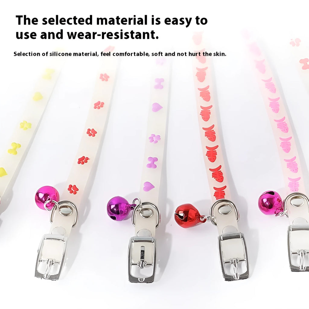 Luminous adjustable cat collar with bell in silicone and metal, showing paw print design for night visibility.