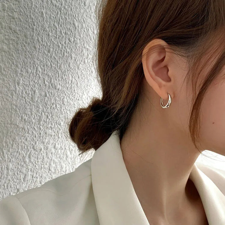 Women's minimalist copper water drop earrings in gold or silver, shown in large, medium, and small sizes.