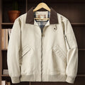 Men's washed cotton baseball flight jacket in Army Green colour on a hanger