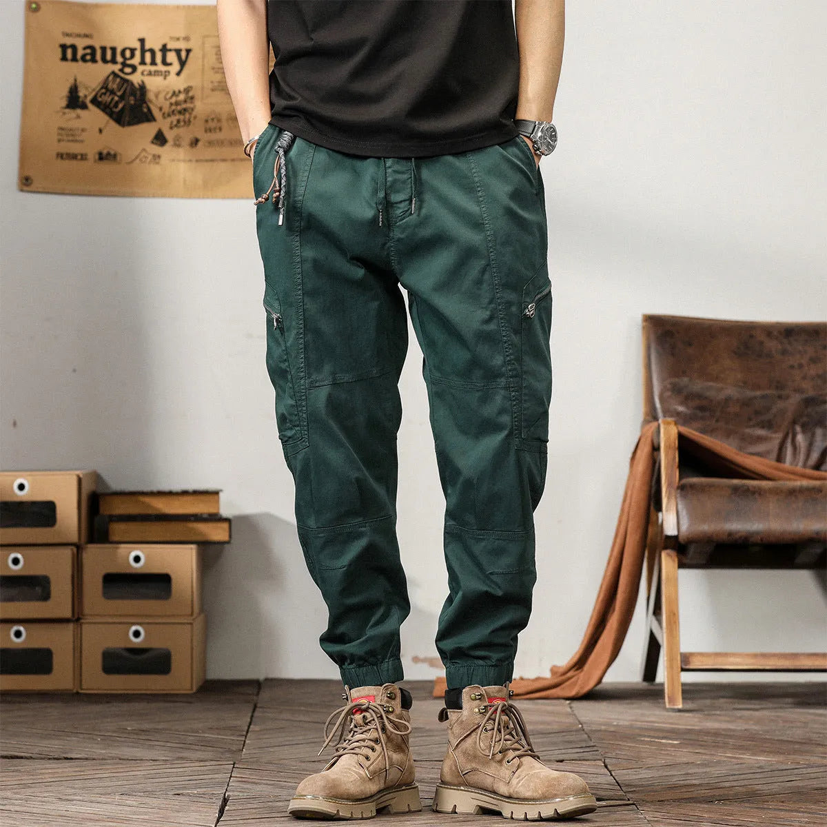 Men's loose khaki cotton harem trousers with tapered leg and ankle banding.
