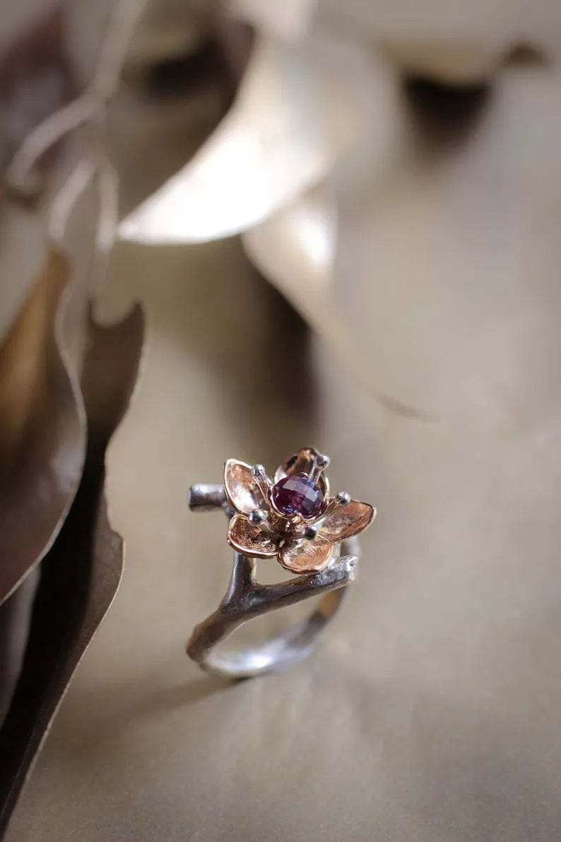 Silver two-tone alloy ring with floral and geometric design for women, showing UK size options.