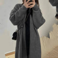 Loose dark grey knitted women's cardigan with 3D pattern texture and open front.