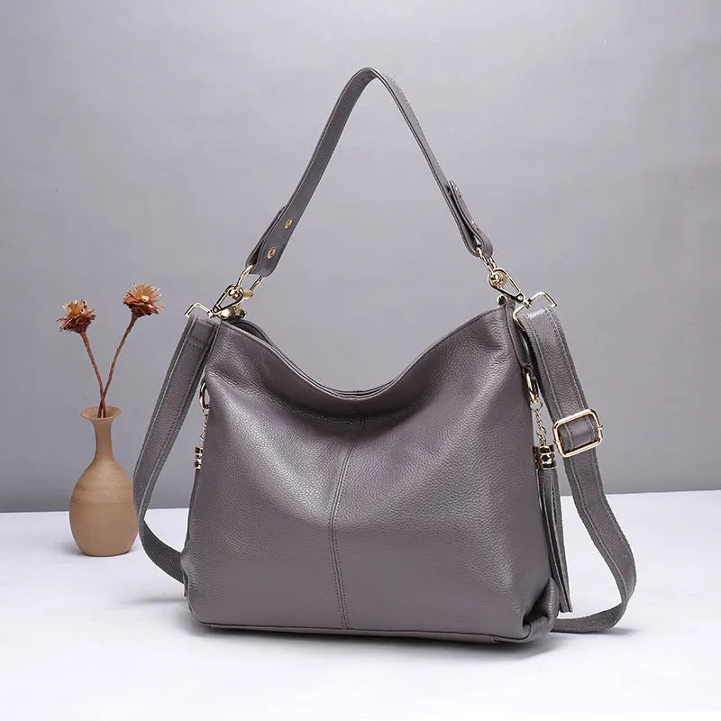 Genuine leather crossbody bag in vertical square shape with internal phone and document compartments
