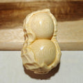 Solid bamboo carving peanut ornament with natural finish and modern simplicity design