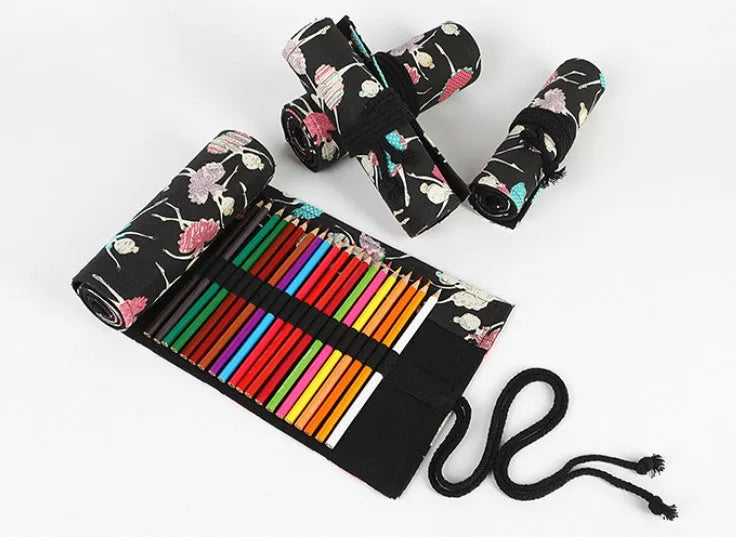 Square canvas rolling pencil case with ballet girl print, showing interior holes for storing pencils.