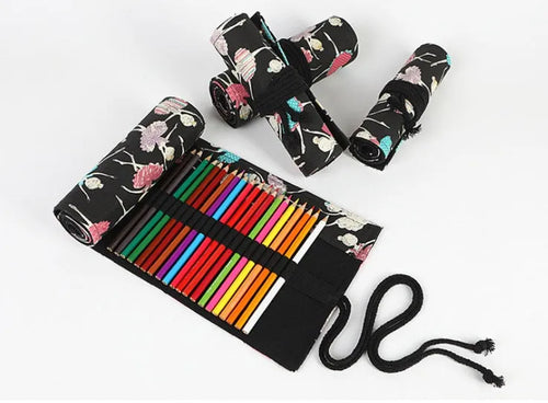 Square canvas rolling pencil case with ballet girl print, showing interior holes for storing pencils.