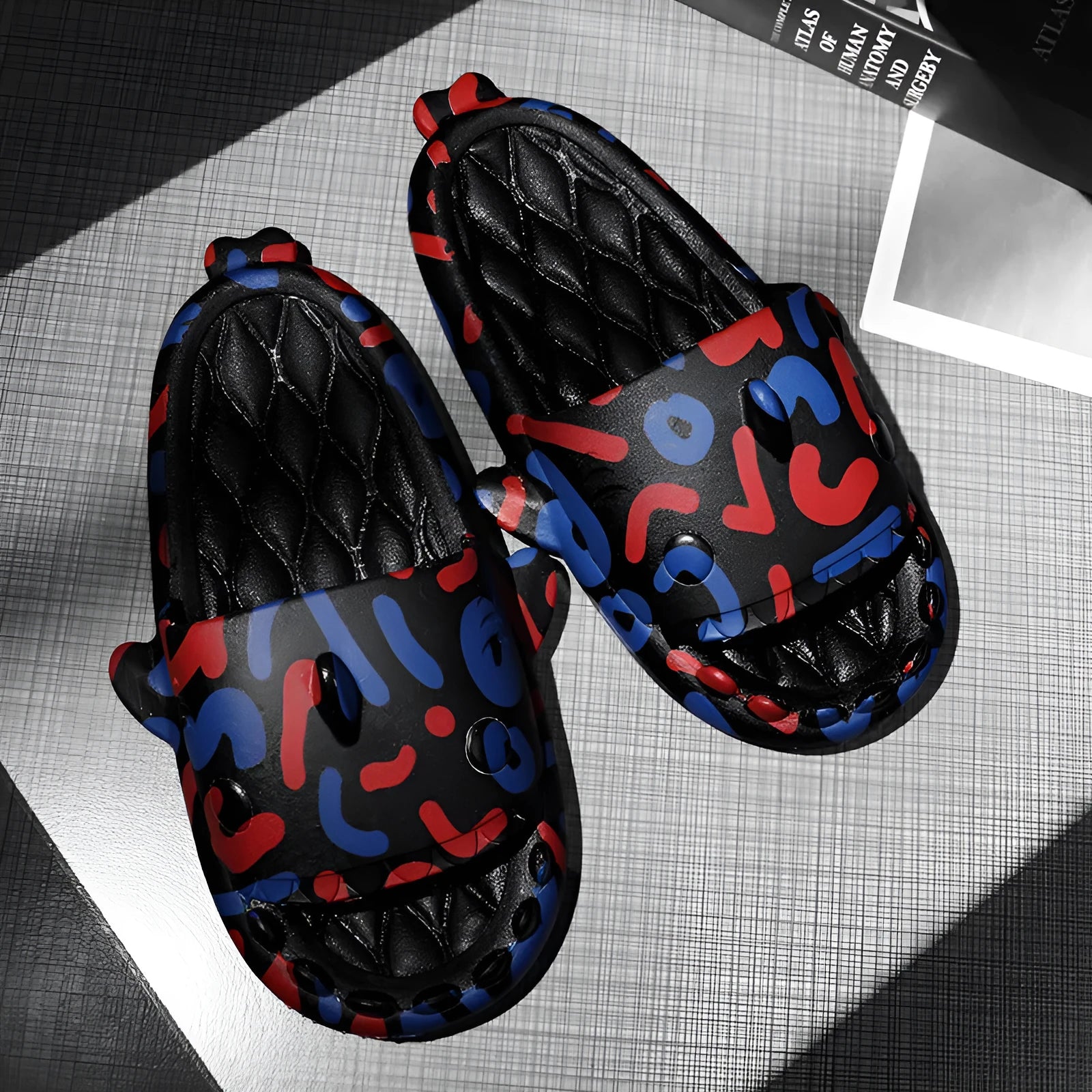 Shark design EVA open toe home slippers for men and women in various colours.