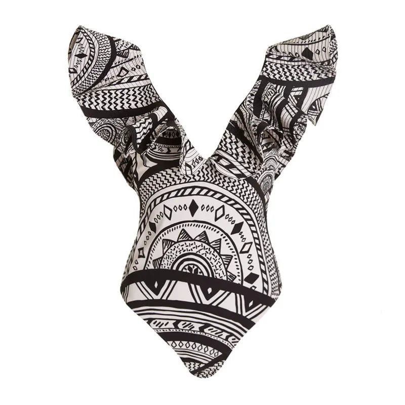 Women's vintage print deep V one-piece swimsuit with ruffles and matching wrap skirt on a mannequin