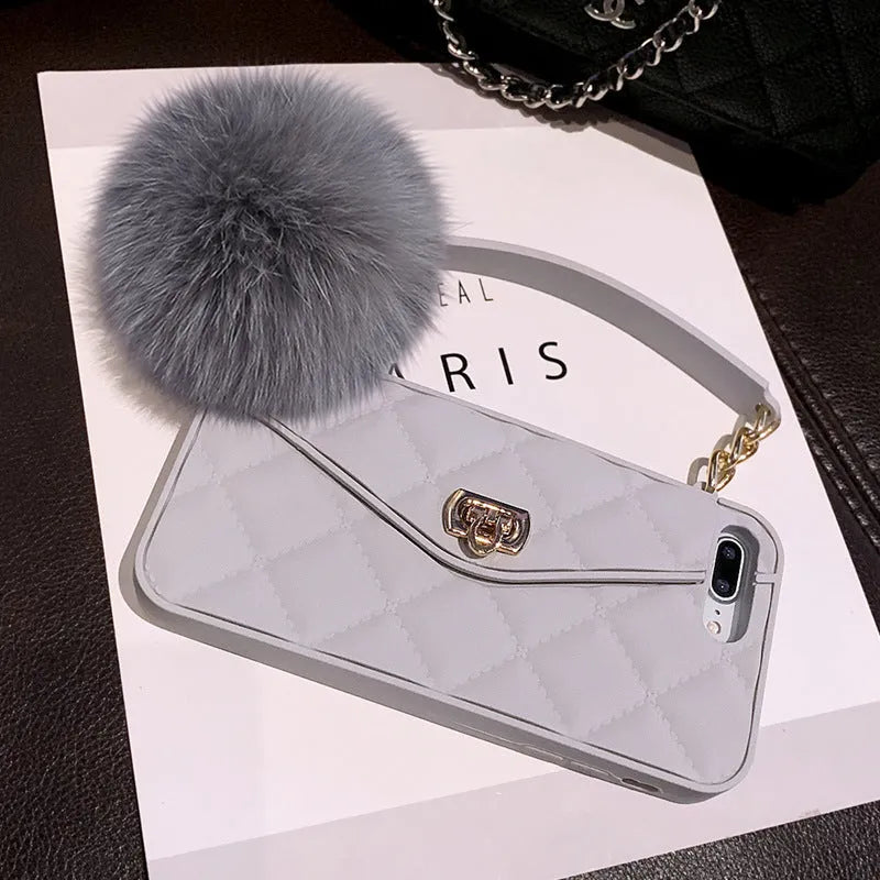 Dark green grid patterned TPU hairball phone case for iPhone, showing plush texture on back cover.