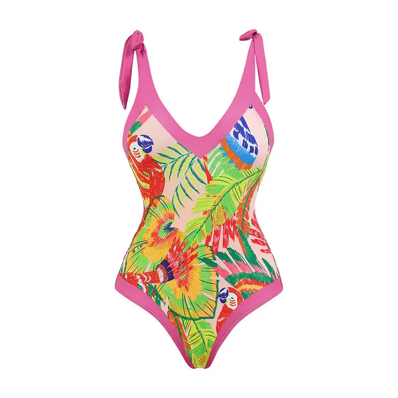 Women's pink floral print one-piece swimsuit with V-neck, covered belly, and attached skirt for swimming