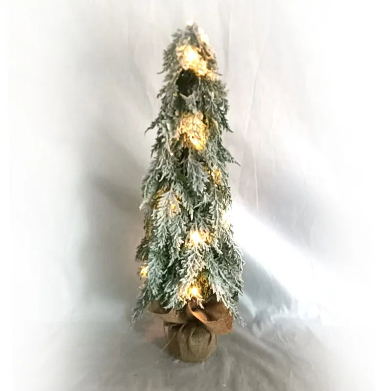 24-inch artificial Christmas tree with white snow finish and built-in LED lights on branches